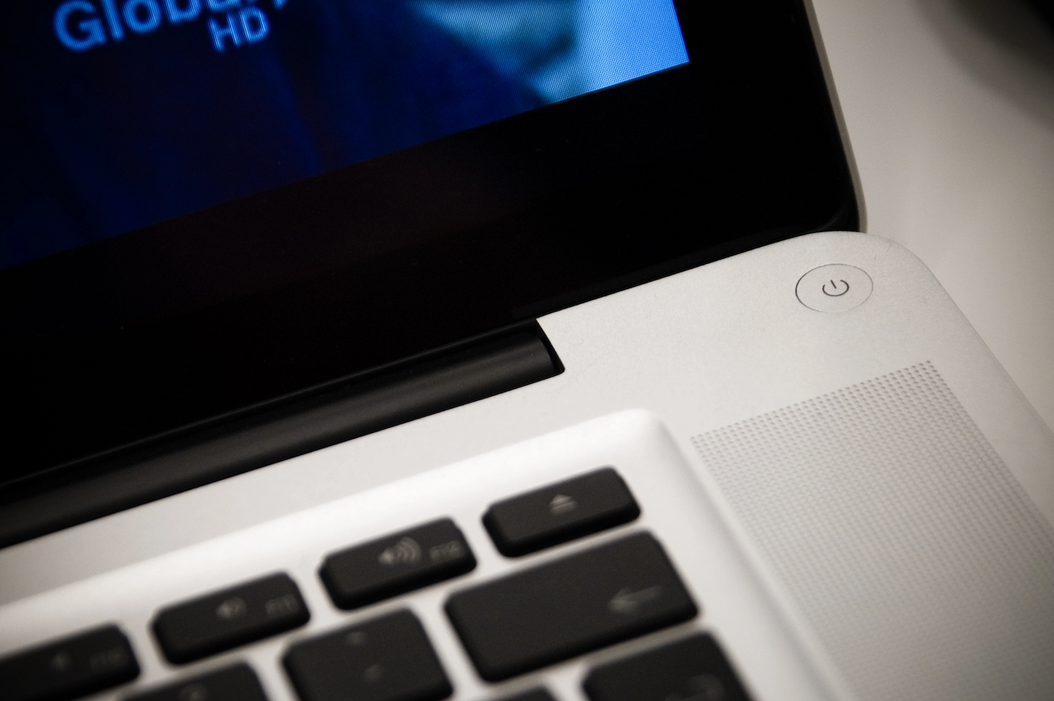 The power button on a laptop keyboard.