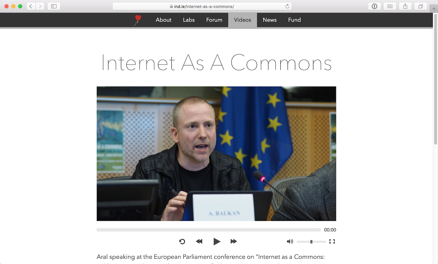 The same video with custom video player controls including a grey timeline, and minimalist icon buttons.