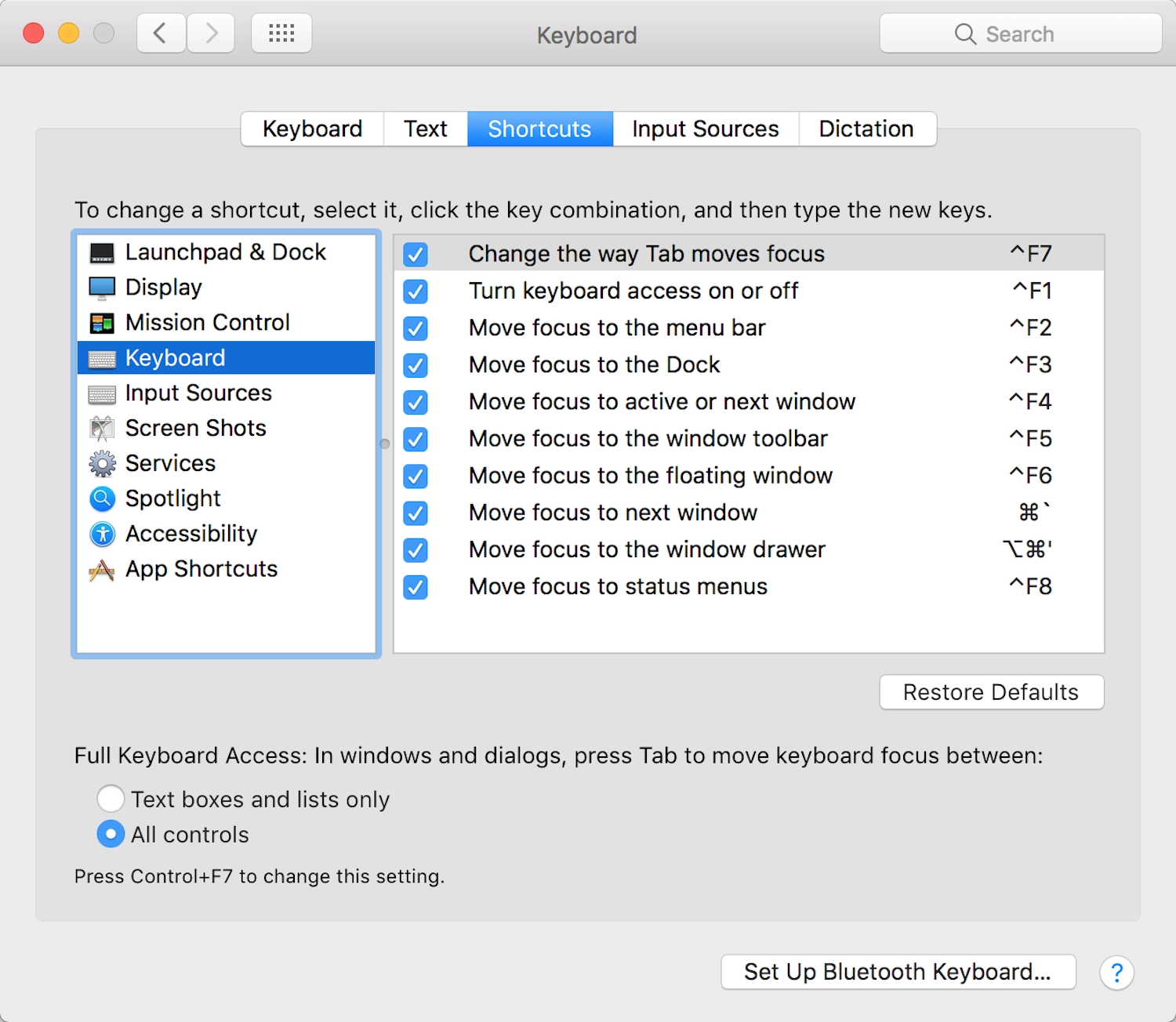 The macOS settings panel for keyboard shortcuts, including a shortcut for Change the way Tab moves focus.